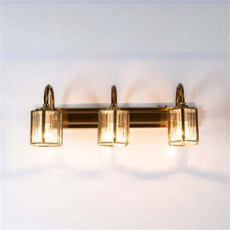 NAGOYA 3 lights mirror light in brass ant finish with frosted glass sh ...
