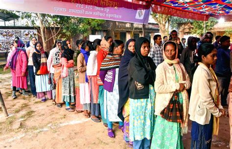 Tribal voters line up at a tribal model polling booth to cast their vote