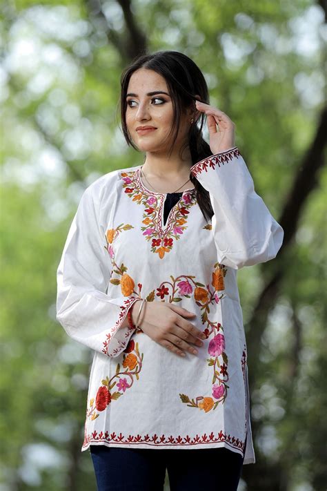 White cotton aari work kurti with multicoloured designer flower