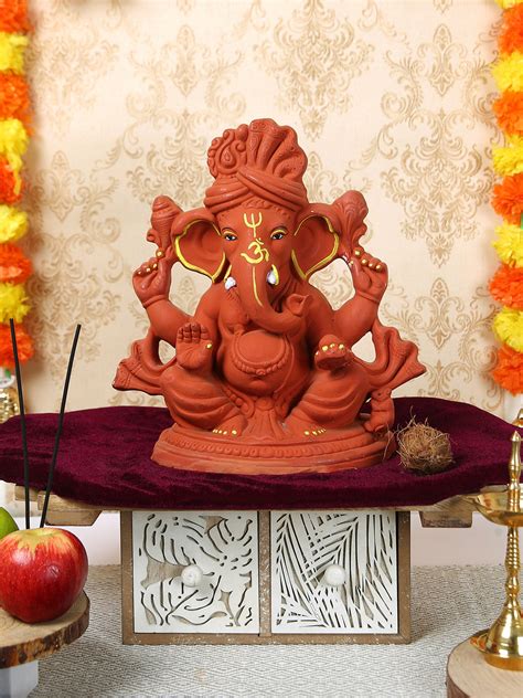 Buy | Orange Coloured & Yellow Ganesha Idol Statue Showpiece | Tied Ribbons