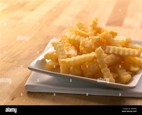 crinkle cut french fries Stock Photo - Alamy