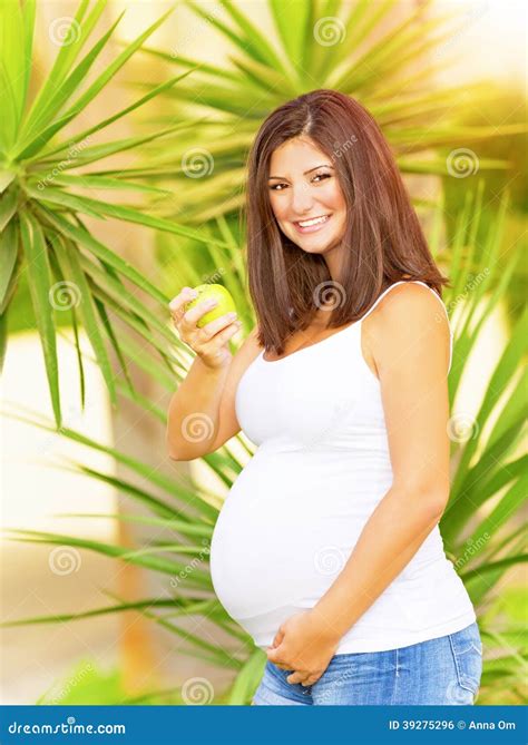 Pregnant Woman Eating Apple Stock Photo - Image of healthy, caucasian: 39275296