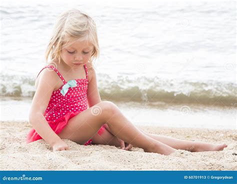 Little Girl Sunbathing On The Beach Stock Photo - Image: 60701913