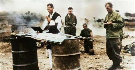 Clergyman Prays for Fallen GIs During the Battle of Ie-Shima