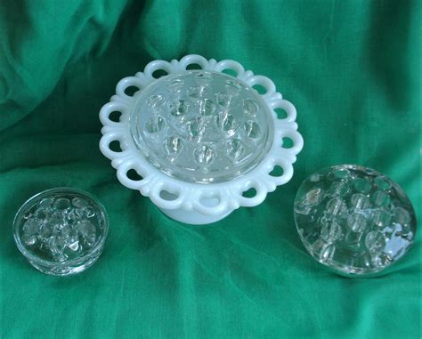 Flower Frogs and milk glass bowl - Schmalz Auctions