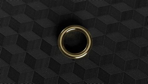 2 golden ring on a black textured background | Premium Photo