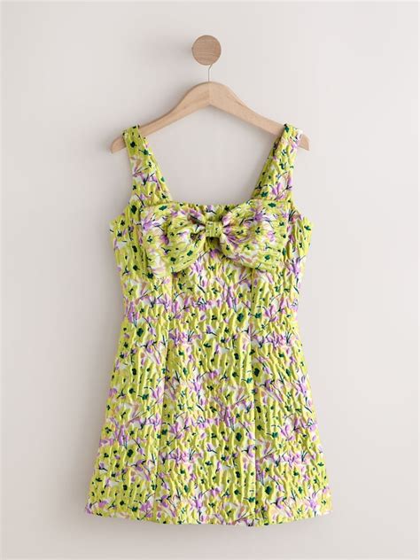 Buy Yellow Floral Jacquard Bow Front Sleeveless Mini Dress from Next India