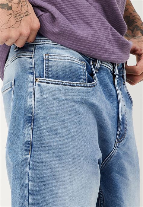 Buy Men Stonewashed Carrot Fit Jeans Online at just Rs. 1499.0 ...