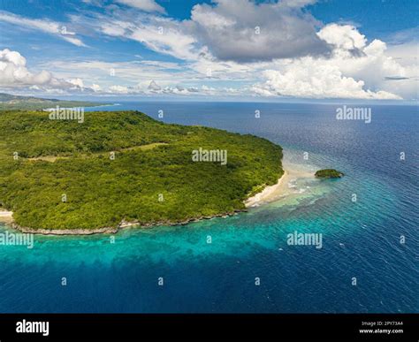 Flying above the Beautiful Tropical Island with a tiny Island near the ...