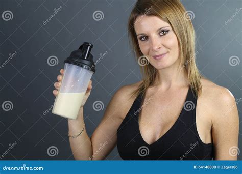 Beautiful Woman Showing a Protein Shake Stock Photo - Image of shake, athlete: 64148800