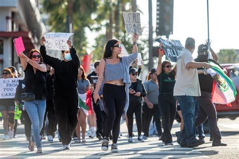Protesters rally outside Angel Stadium against ICE sweeps in Anaheim ...