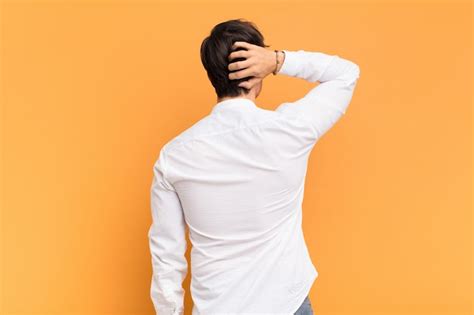 Thinking or doubting, scratching head, feeling puzzled and confused ...