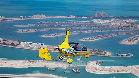 gyrocopter dubai, gyrocopter flight dubai, gyrocopter ride dubai, dubai aerial tour, palm jumeirah gyrocopter, burj al arab gyrocopter, dubai marina views, dubai adventure experience, dubai sightseeing flight, my emirates pass offer, emiratespass15 discount, 15 percent off dubai, dubai vacation deals