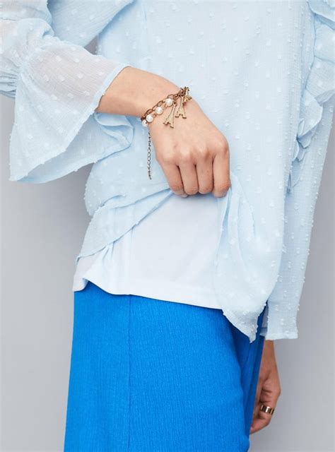 Buy Women Dobby Woven Ruffled Blouse Online at just Rs. 799.0 ...