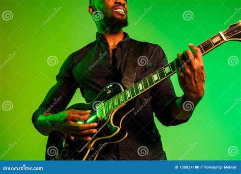 Young African-american Jazz Musician Playing the Guitar Stock Photo ...