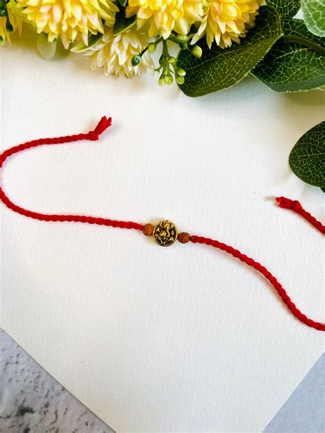 Ganesha Embossed Twisted Dori Bhai Rakhi – Madhurya Rakhi