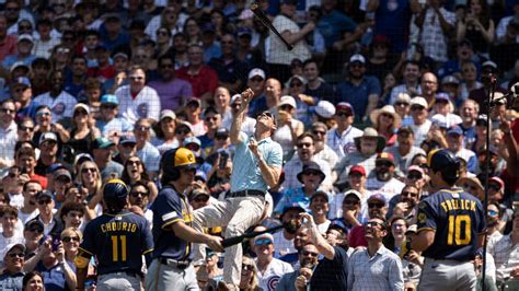 Fan climbs Wrigley Field netting to retrieve Sal Frelick's bat - ESPN