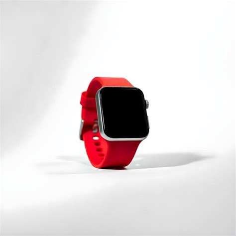 A red watch with a black face and a black band | Premium AI-generated image