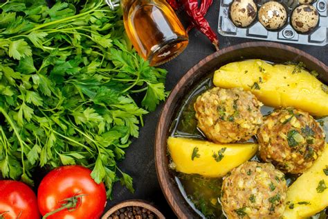 Top view of tasty meatball meal fresh vegetables eggs green pepper ...