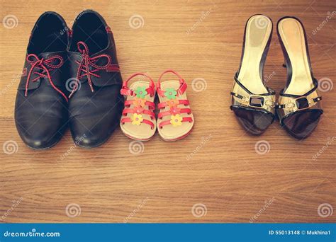 Three Pairs of Shoes: Men, Women and Children. Stock Photo - Image of ...
