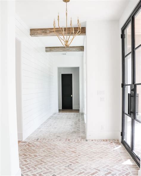 Triple C Farmhouse Mud Room with Brick Flooring and Chandelier