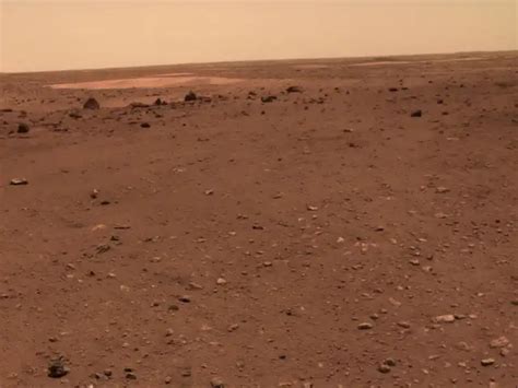 Chinese rover and lander pose for a group portrait on dusty, rocky ...