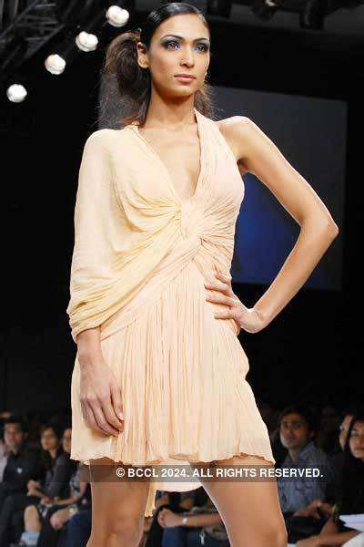 Mashoom Singha displays a creation by designer Swapnil Shinde on Day 4 ...