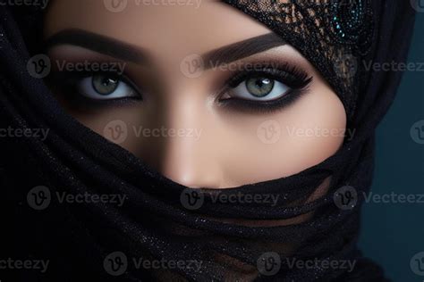 Portrait of beautiful Arab woman with blue eyes wearing black scarf ...