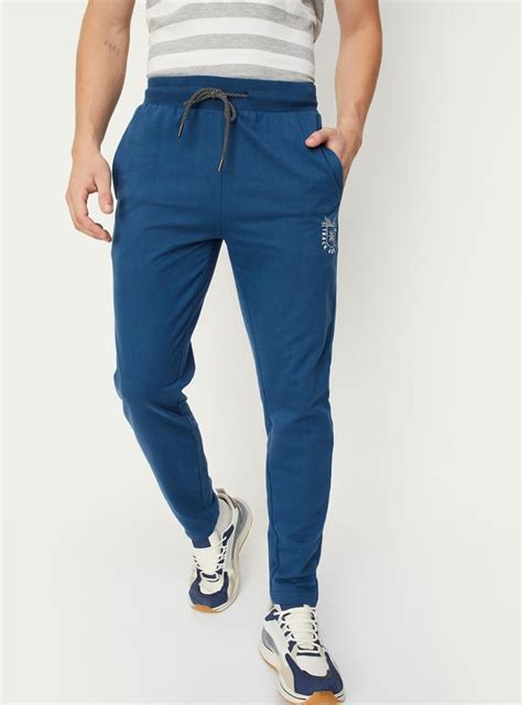 Buy Men Solid Athleisure Track Pants Online at just Rs. 699.0 ...