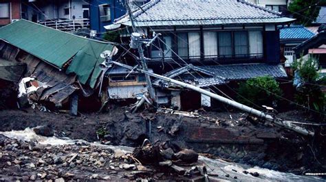 Japan mudslide: 4 dead, dozens missing as rescue crews search through ...