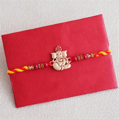 Send Ganesha Rakhi with Haldiram Besan Laddu Online