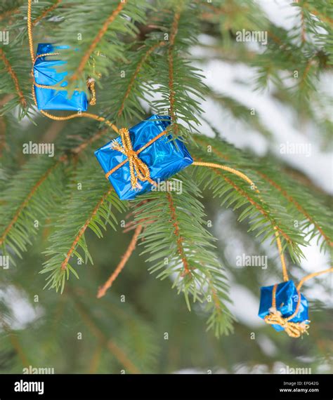 Little christmas gifts on Christmas tree Stock Photo - Alamy