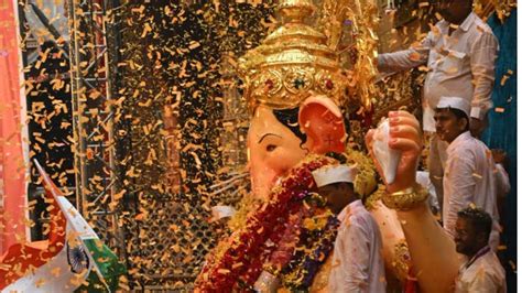 In Photos Lalbaugcha Raja greeted with petals colours as devotees wait ...