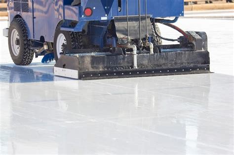 Special machine for cleaning ice on an ice rink at work. transport ...