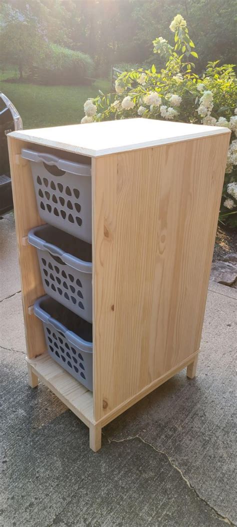 I built a laundry basket cabinet that matches my bedroom furniture. : r/DIY
