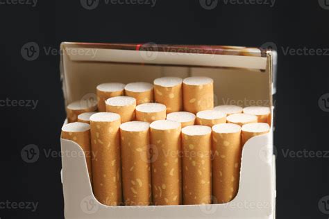 peel it off Cigarette pack prepare smoking on white wooden background ...