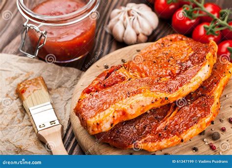 Marinated Raw Pork Steaks on Cutting Board Stock Image - Image of ...