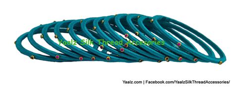 Yaalz Silk Thread Weightless Thin Dozen Bangles With Kundan Stones In