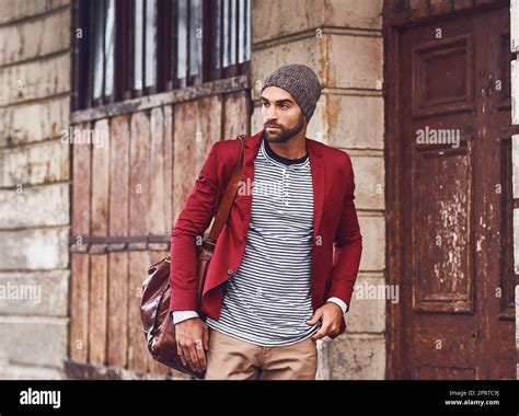 Always on the move in style. a handsome young man with a red jacket ...