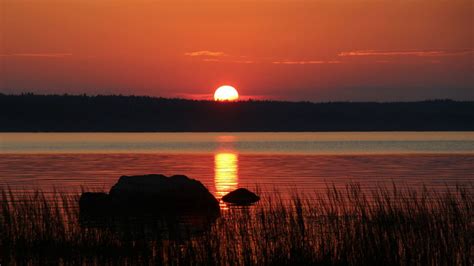 Download wallpaper 1366x768 river, stones, grass, sunset, dark tablet ...