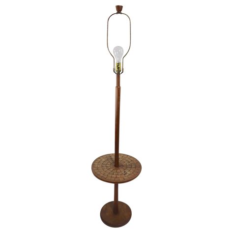 Sleek mid century brass pole floor lamp at 1stDibs