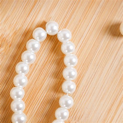 Whimsical Satin Bow And Pearl Keychain Online - Premium Keychain | Nestasia