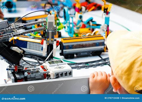 Robot Constructor. Defocus Little Boy Made Robots on Table. Train an ...