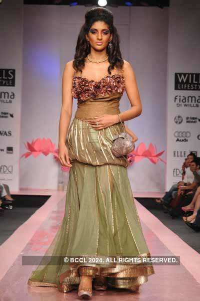 Vasuki displays a creation by designers Ashish, Viral and Vikrant ...