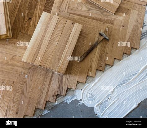 Top view of parquet boards installing in herringbone arrangement on ...