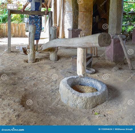 Traditional Rice Milling with a Wooden Mortar and Pestle,Rice Mortar ...
