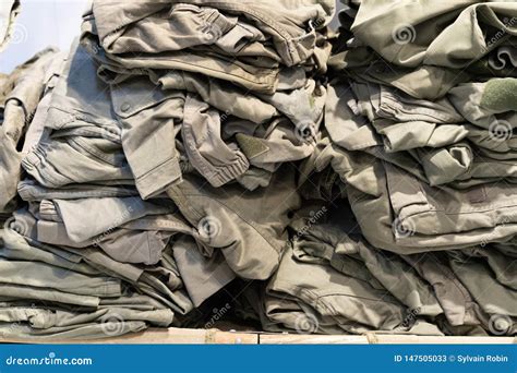 Green Camouflage Surplus of Military Clothes in the Store for Sale ...