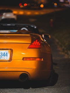 Download wallpaper 240x320 car, sports car, rear view, yellow ...