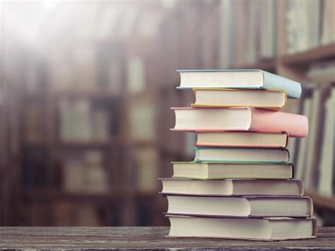 The stack of study books in the library on the table. | Premium Photo