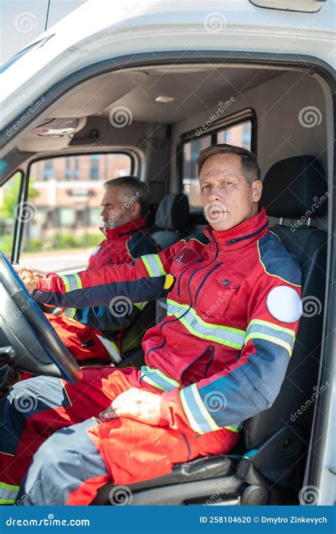 Paramedical Personnel Seated in a Medical Emergency Vehicle Stock Photo - Image of volunteer ...
